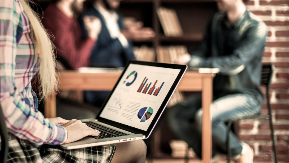 accountant-works-with-financial-charts-laptop-offi